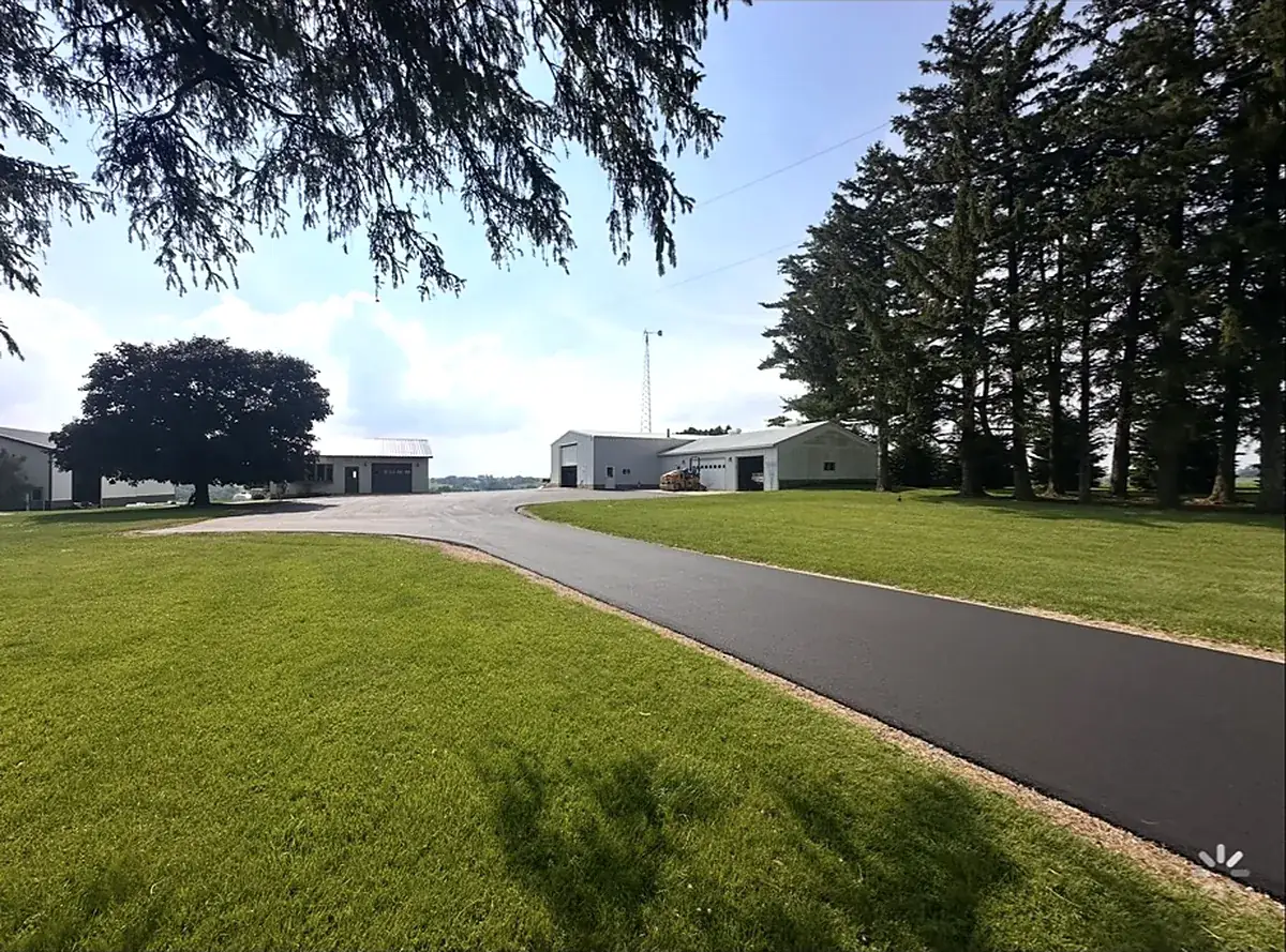 Drive curving through the yard to the shop
